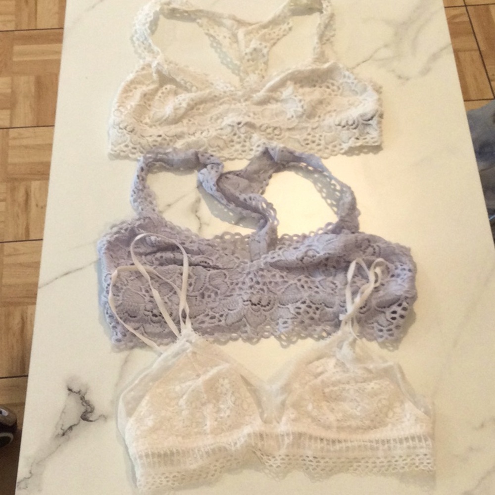 Lace Bralette Set with 2 white and one light blue bralettes, size small.